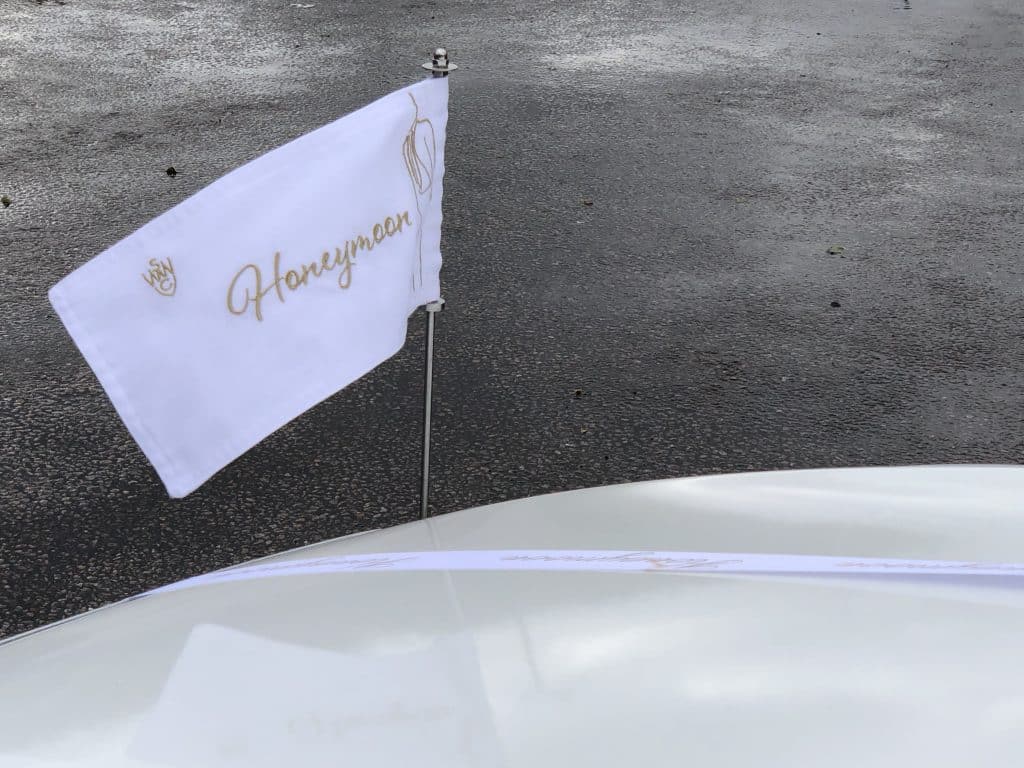 Honeymoon airport transfer car flags